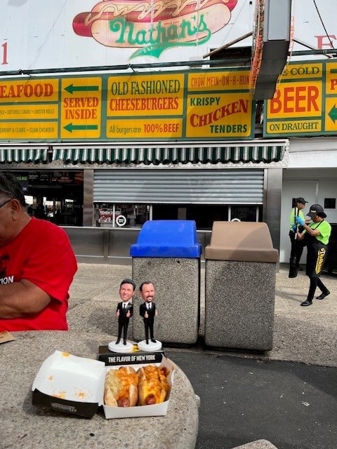 Little Jimmy & Danny eating Nathan's Hot Dogs in Coney Island, New York